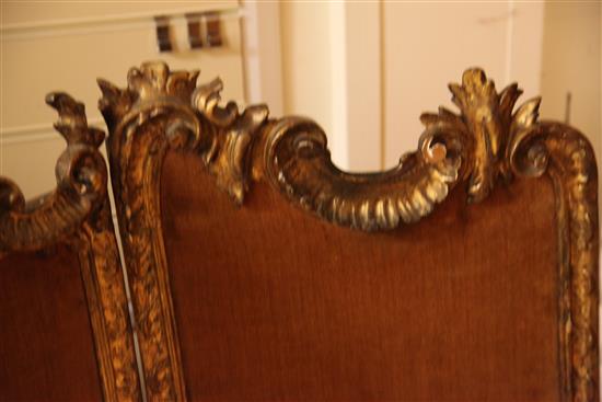 A low Louis XV style carved giltwood three fold screen, H.4ft 1in.